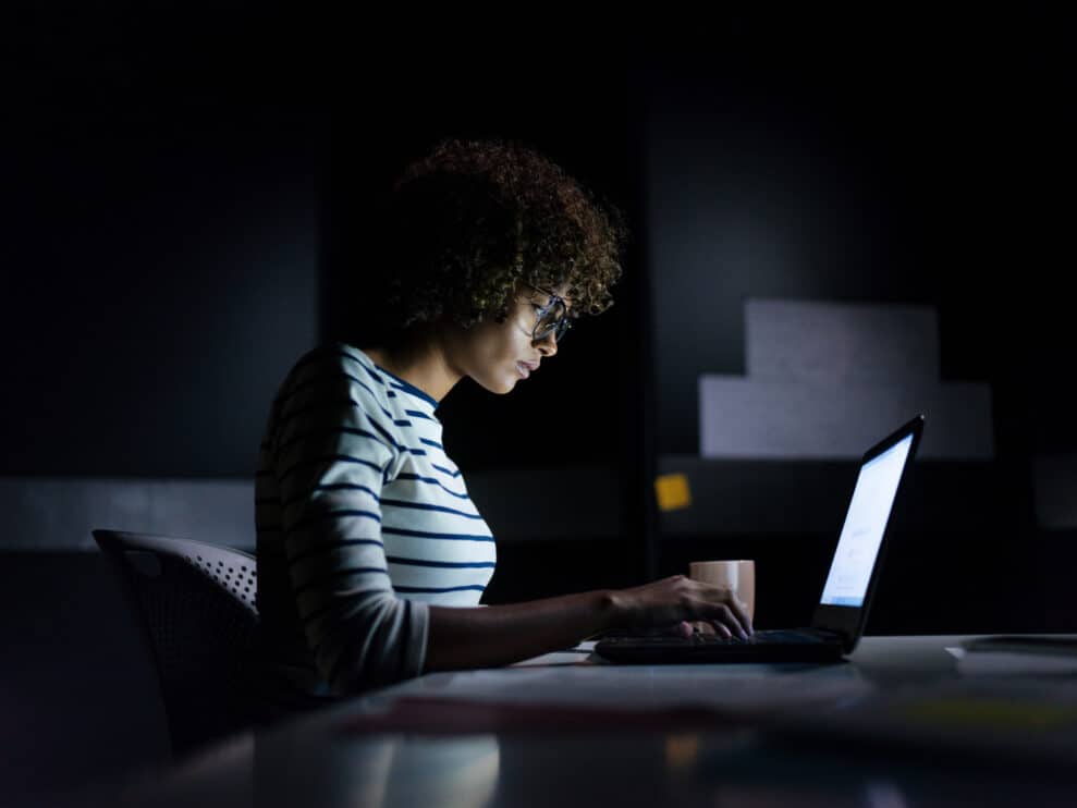 concentrated-businesswoman-working-late-hours-with-her-laptop