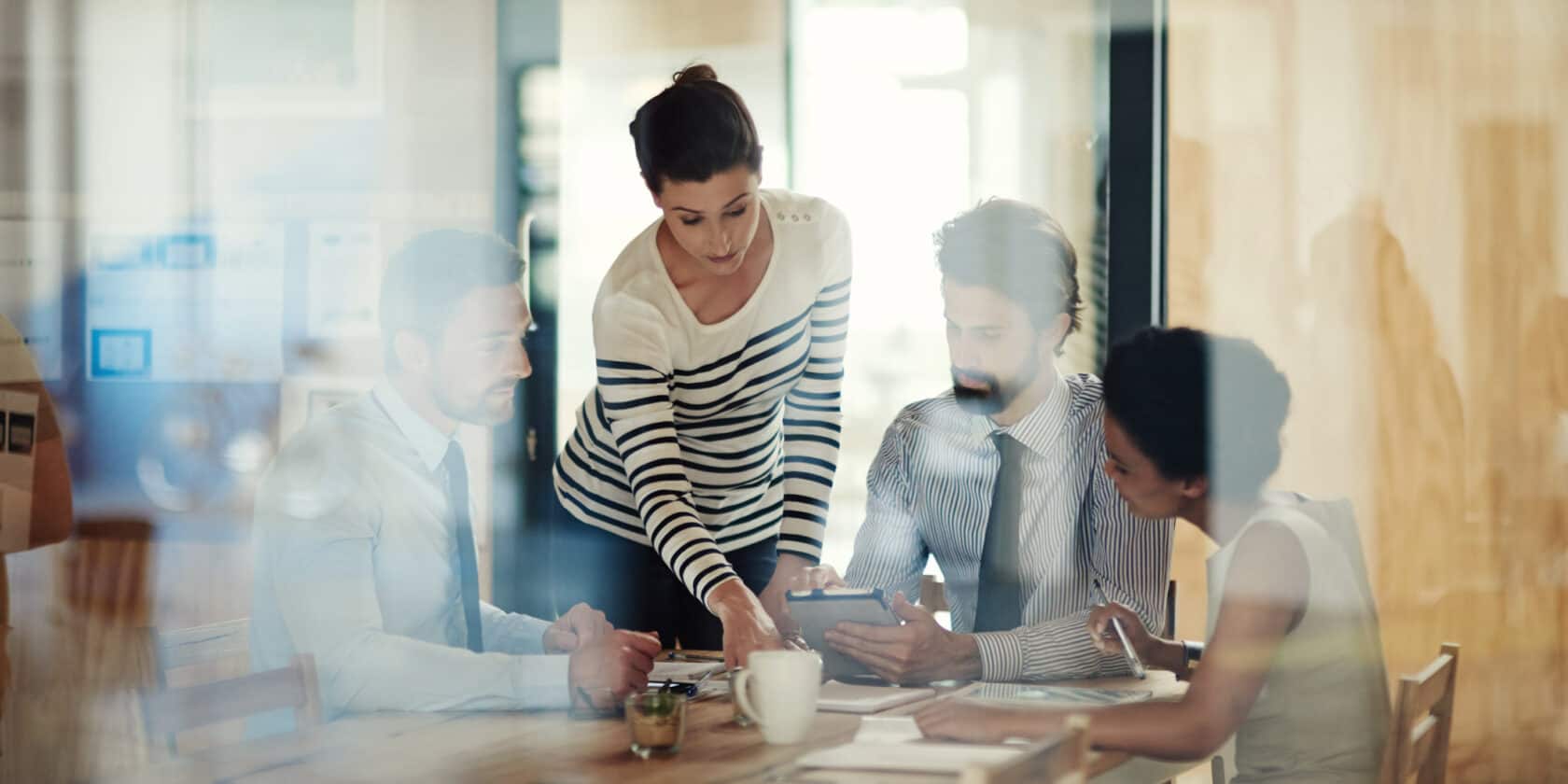 A group of people working together in a conference room.