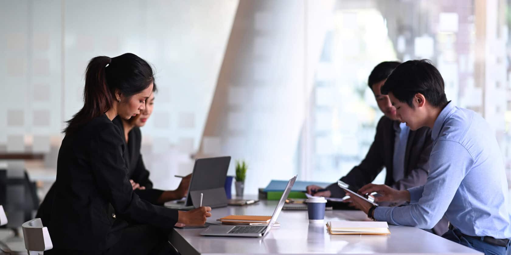 A group of people working together at a table.