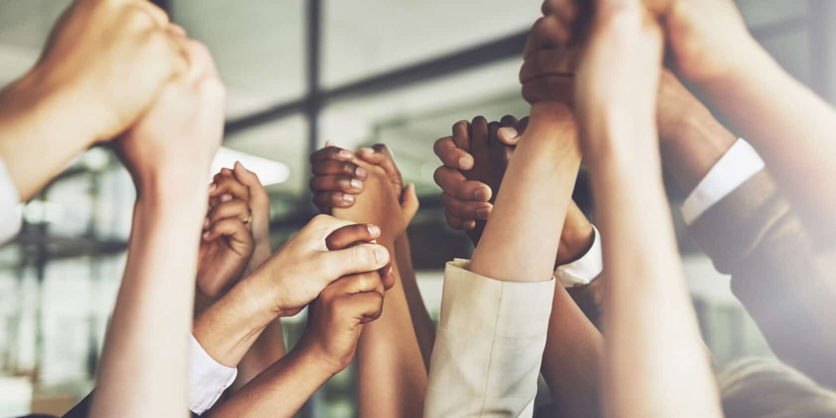 A group of people holding hands.