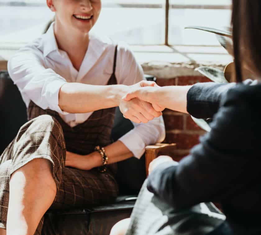 Two people shaking hands.