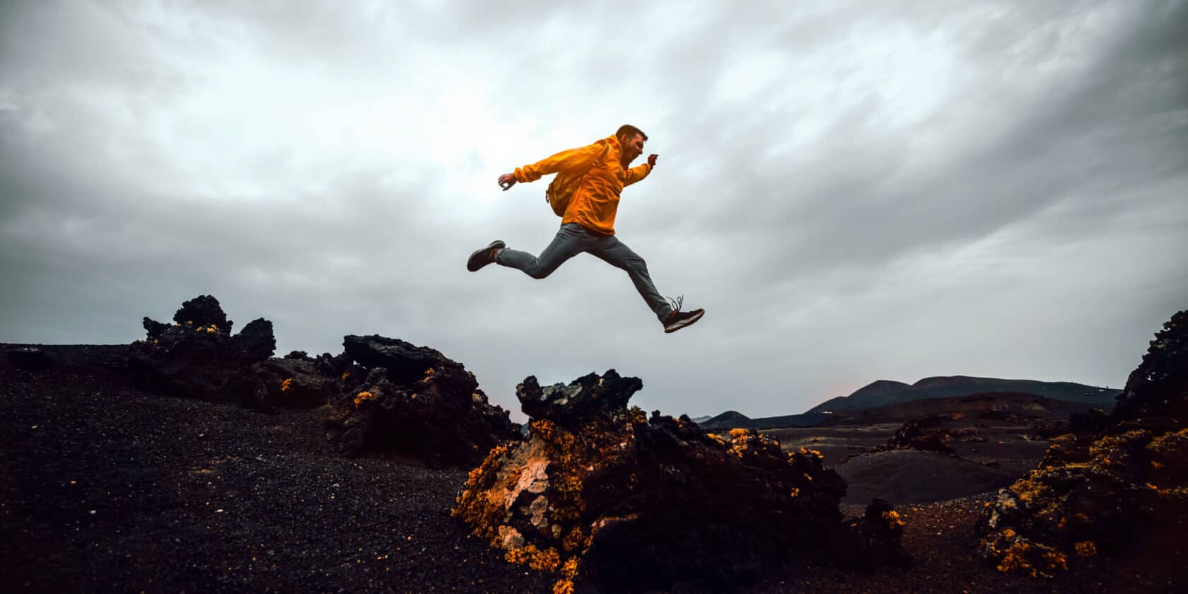 A hiker jumping.