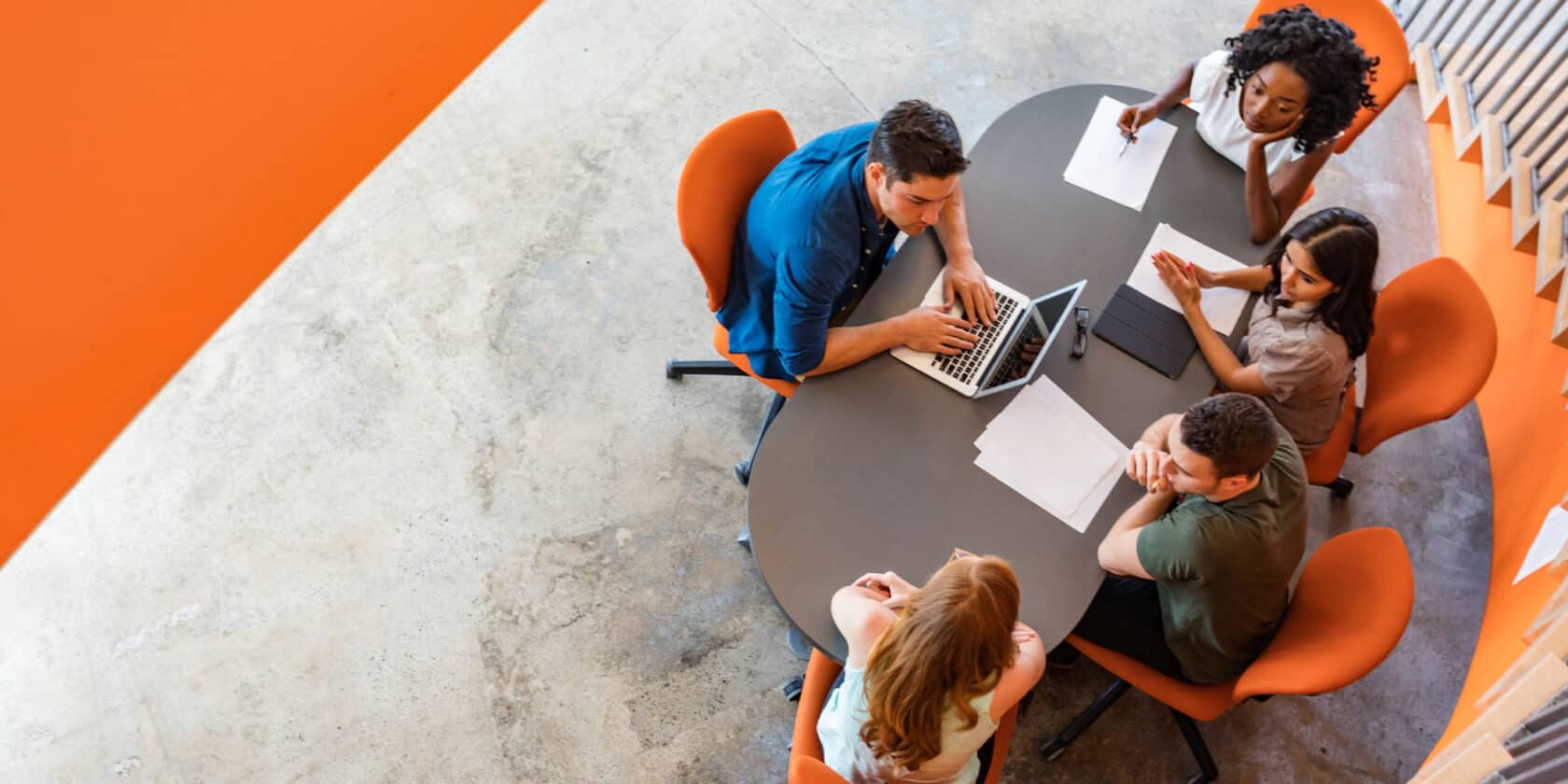 A group of people working together at a table.