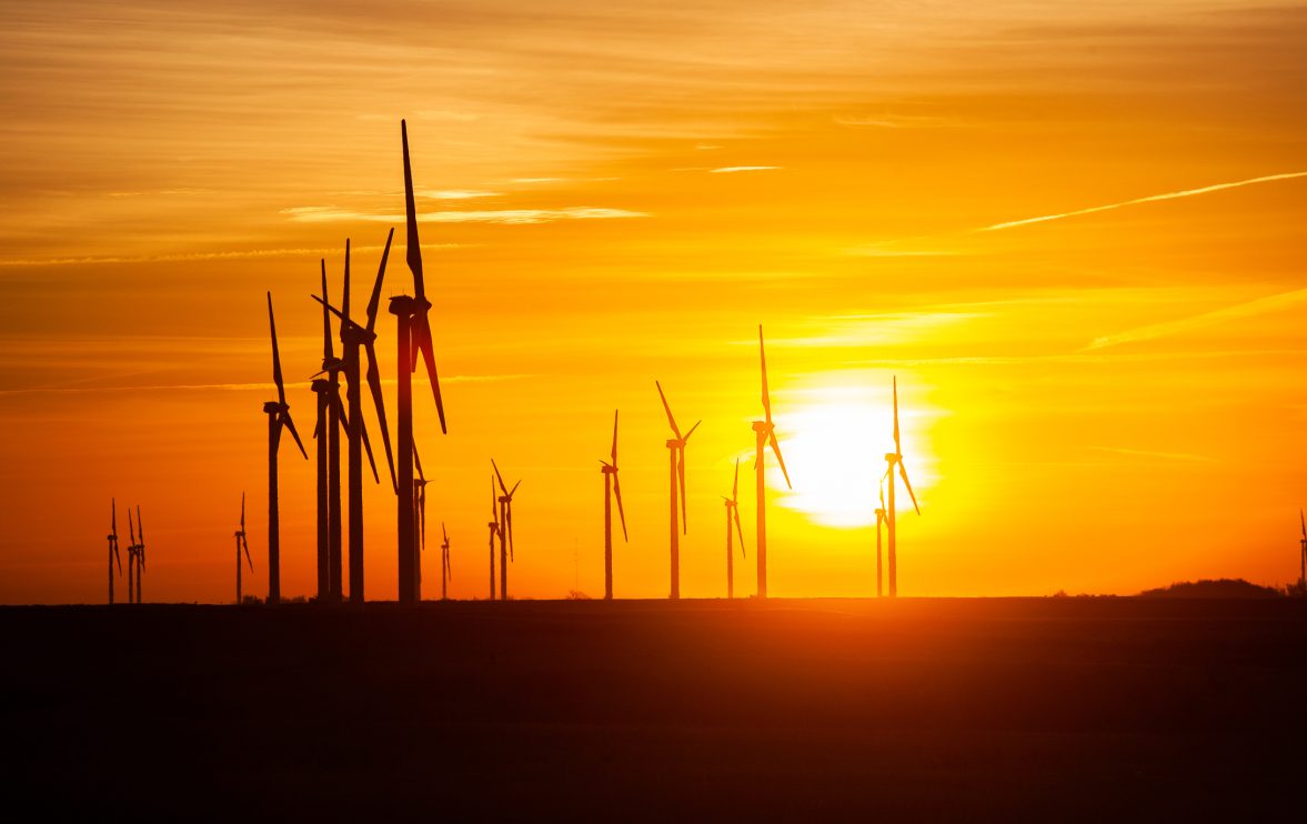 kansas-wind-farm-with-agriculture-at-sunset