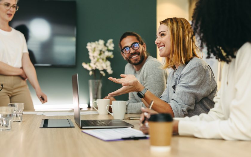 business-woman-talking-to-her-colleagues-during-a-meeting-in-a-boardroom